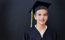 teen boy in his cap and gown