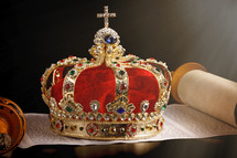 Kings Coronation Crown and an Open Hebrew Scroll on a Black Background
