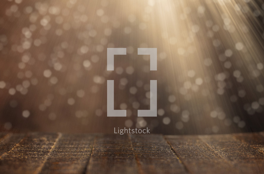 wooden background with radiating bokeh light 