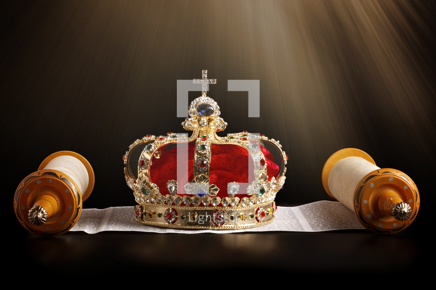 Kings Coronation Crown and an Open Hebrew Scroll on a Black Background
