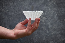 Hand holding a coffee filter