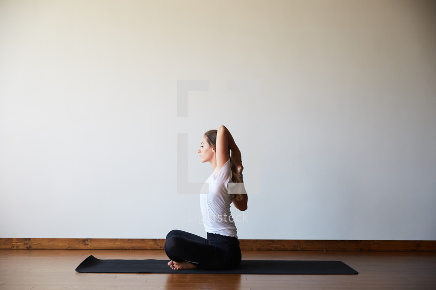 stretching in a yoga studio 