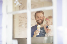 father and daughter eating ice cream 