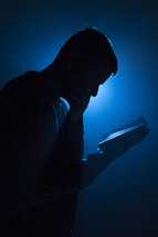 a man reading a Bible 