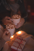 a couple drinking hot chocolate together 