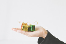 small gifts in cupped hands 