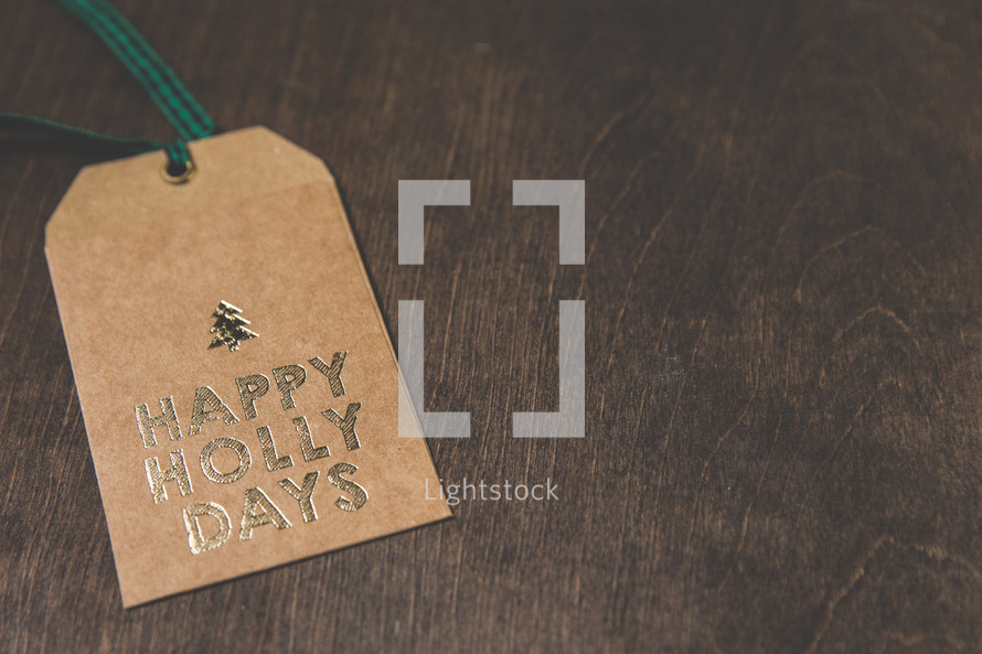 happy holly days on a gift tag 