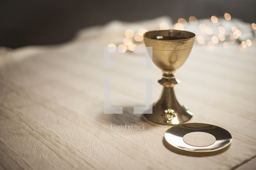 chalice and host with bokeh lights 