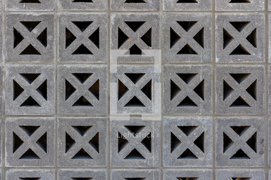 Decorative cinder blocks form a grid pattern of squares and diagonals
