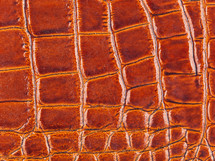 synthetic leather, brown background