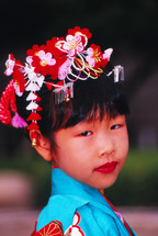 Japanese girl in traditional head dress and clothing 