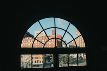 view of brick buildings through a window 
