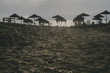 straw umbrellas on a beach 