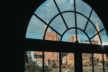 view of brick buildings out a window 