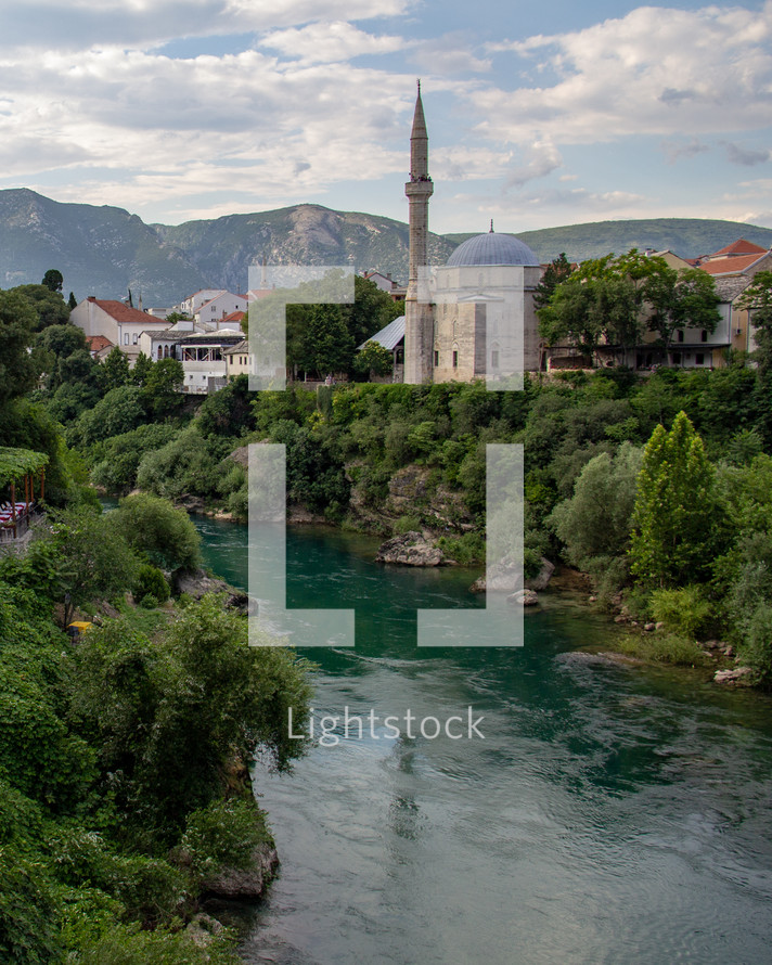 Koski Mehmed Pasha Mosque on the banks of the Neretva River in Mostar, Bosnia and Herzegovina on a sunny day