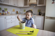 kid planting seeds in a kitchen 