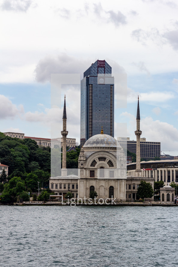 Istanbul, Turkey - View of the Dolmabah Mosque on the banks of the Bosphorus Strait, S..zer Plaza is in the background