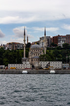 Istanbul, Turkey - View of the Dolmabah..e Mosque on the banks of the Bosphorus Strait