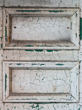 old white door with cracked and peeling paint 