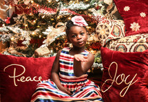A little girl blowing a Kiss at Christmas 