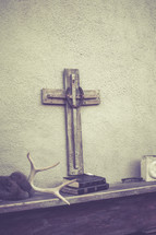 cross and a stack of Bibles 