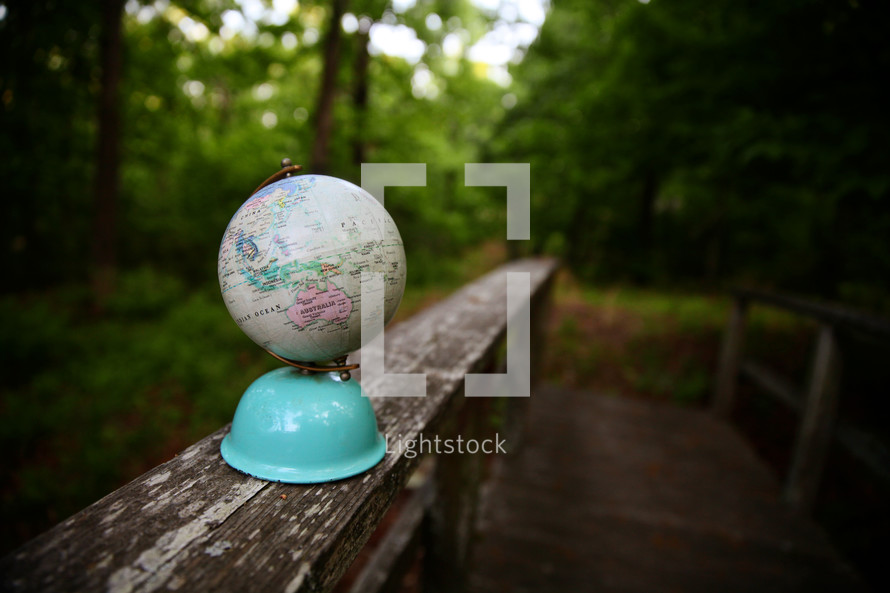globe on a railing 