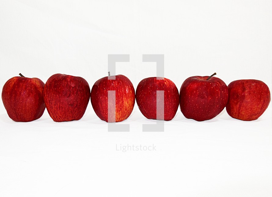 Row of red apples.