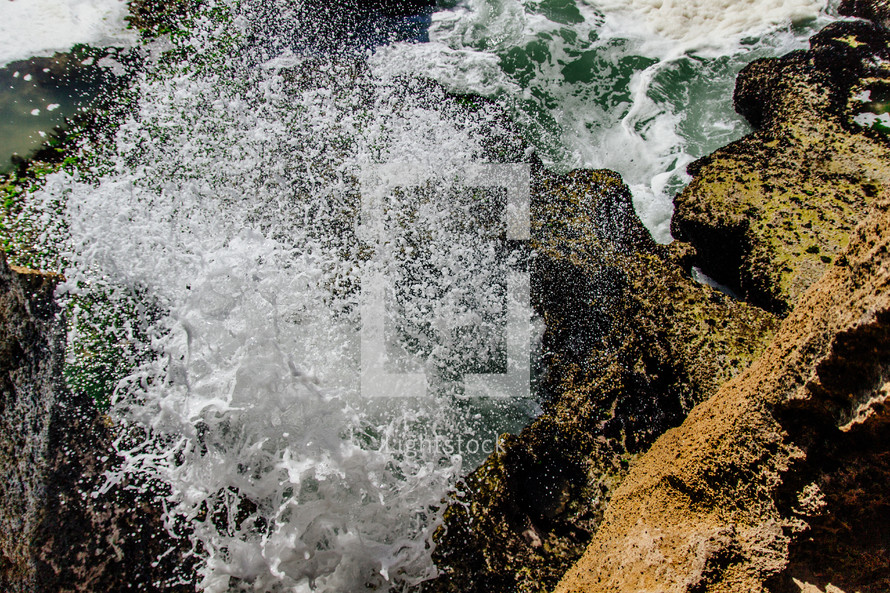 sea water washing over rocks 