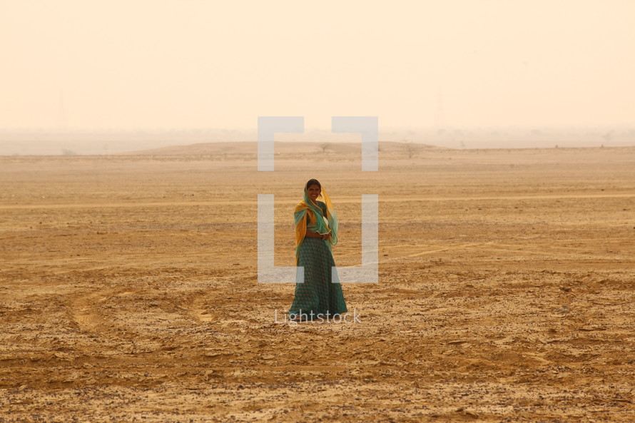 woman standing in a desert in India 