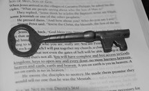 skeleton key on the pages of a Bible 