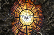 White dove of the Holy Spirit in a stained glass window 