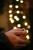 prayer hands with christmas lights