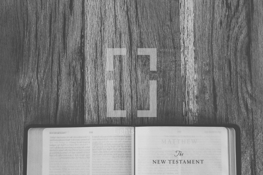 sideways Bible opened to The New Testament 