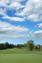 Golf course under the clouds.