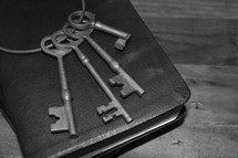 skeleton key on the cover of a Bible 