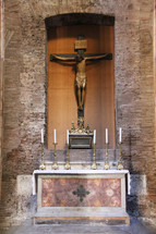 Crucifix at an altar 