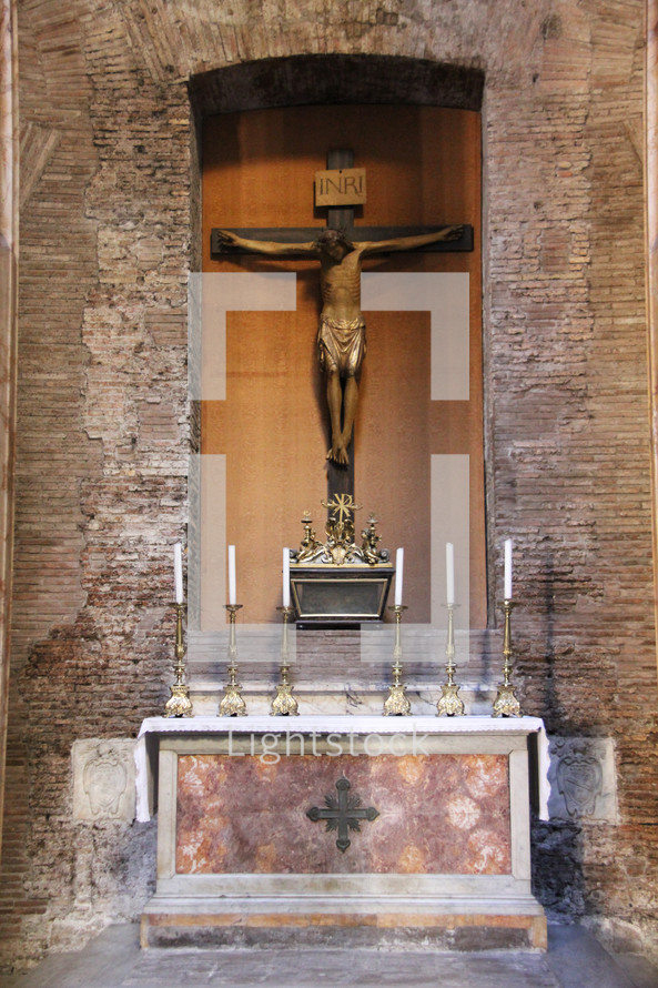 Crucifix at an altar 