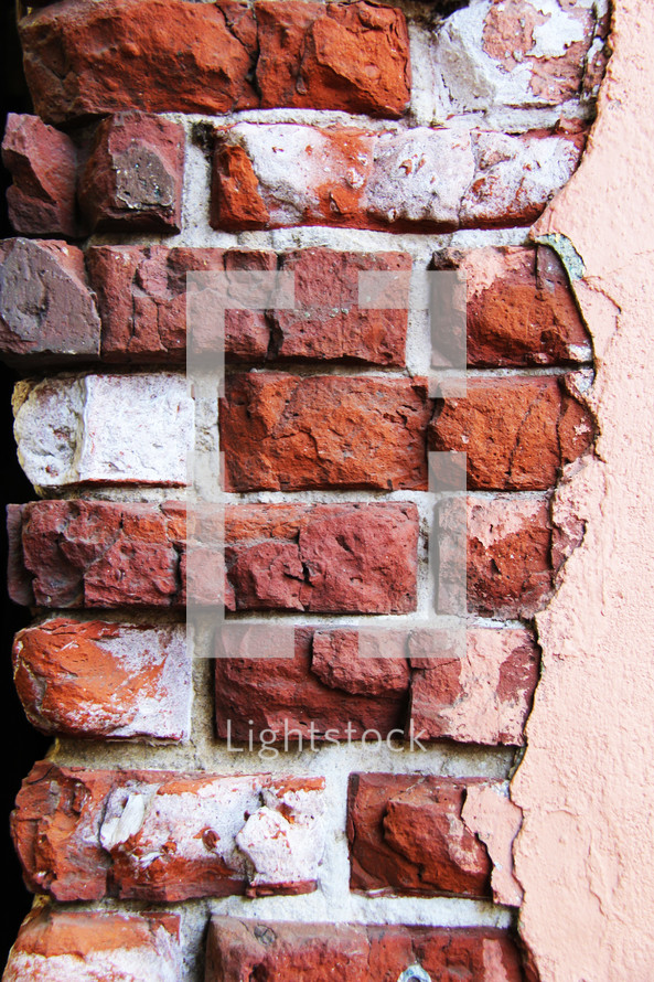 Stucco on a brick wall.