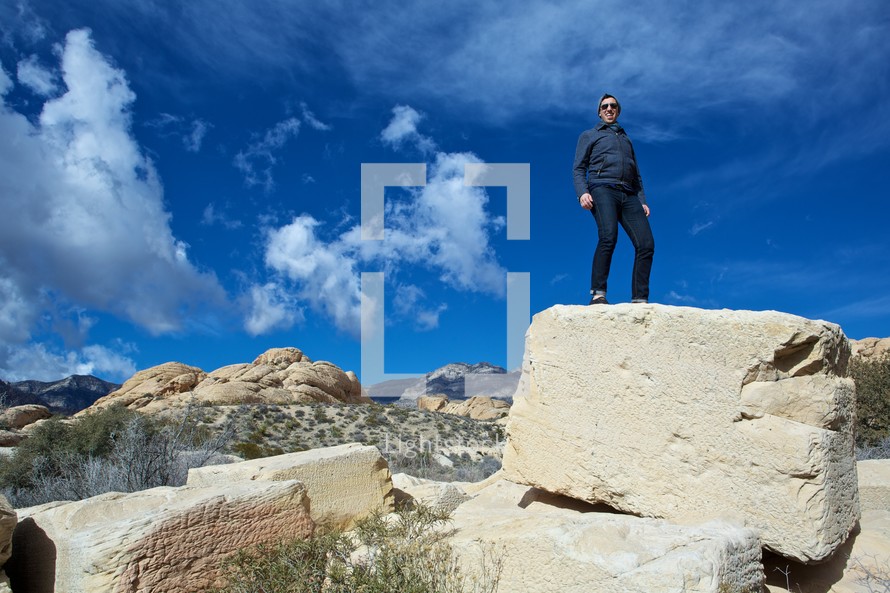 man standing on top of a rock in Nevada