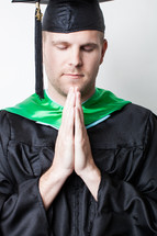 Graduate praying.