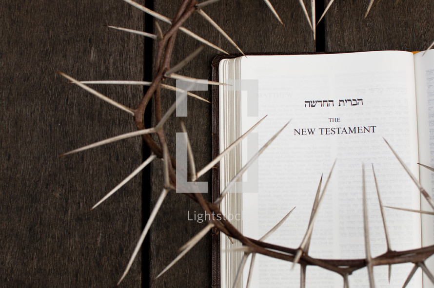 Crown of Thorns on Top of a new testament in Hebrew and English 