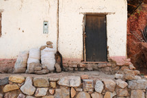Rustic door in a stucco and stone house.