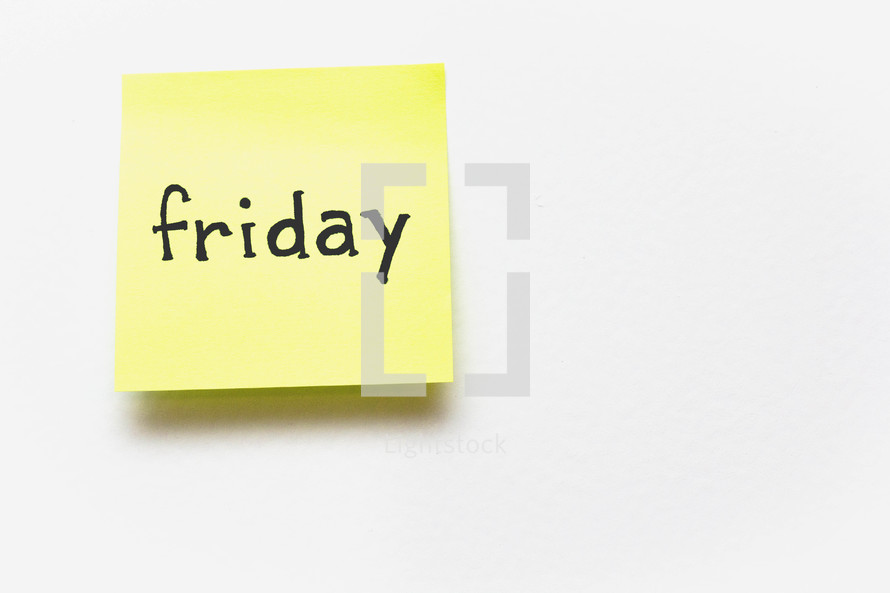A yellow sticky note with "friday" written in black ink.