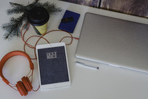 headphones, iPad, Holy Bible, laptop, journal, coffee cup, pine boughs