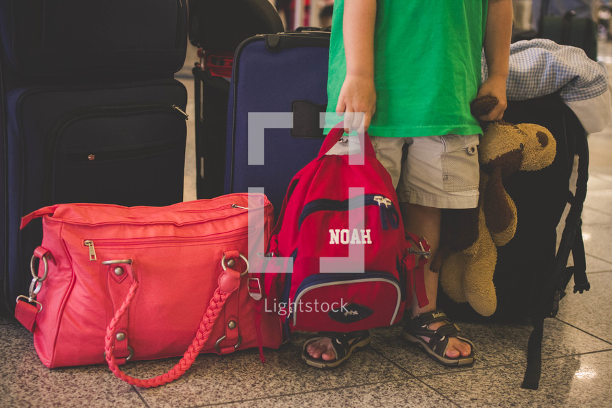 child carrying bags and luggage 