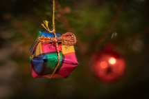 a handmade ornament hanging on a Christmas tree 