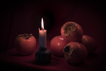 pomegranates and candle 