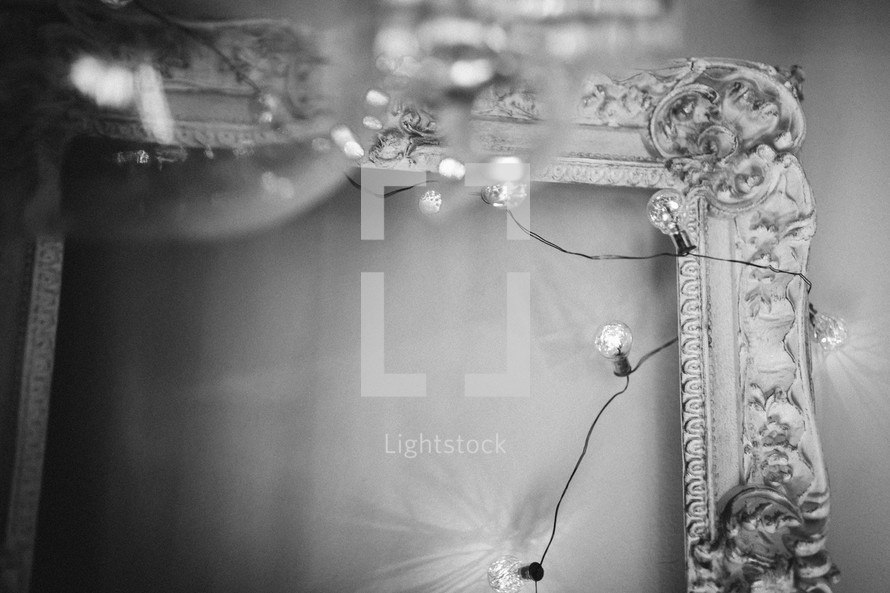 a vintage frame with lights in black and white