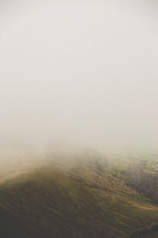 mountaintop in fog 
