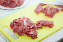 raw meat on a cutting board 